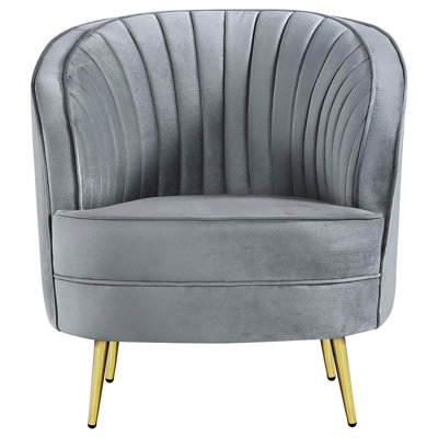 Fauteuil confortable recouvert de velours gris et doré