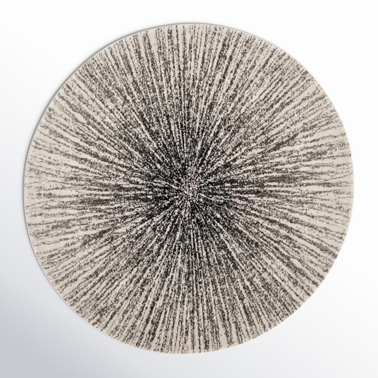 Tapis noir et ivoire à motif abstrait