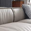 Canapé modulaire gris en cuir véritable avec repose-pieds