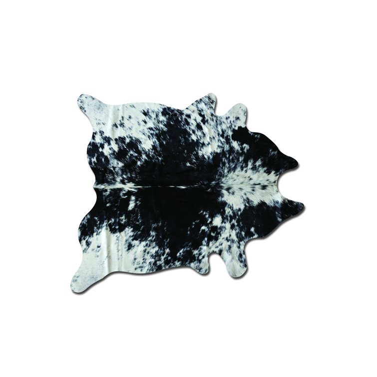Tapis noir / blanc en cuir de vache fabriqué à la main Abhinav