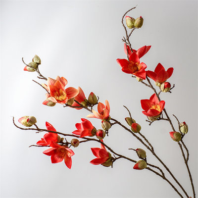 Arrangement de fleurs artificielles - vase élégant jumelé à des fleurs artificielles