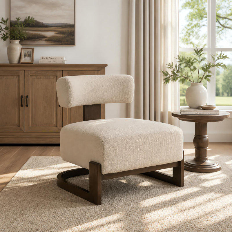 Fauteuil lounge Solven de style moderne du milieu du siècle, sans accoudoirs, avec piètement en bois courbé et coussin de dossier cylindrique, idéal pour le salon ou le coin lecture.