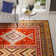 Tapis orange / or Aderito