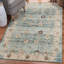 Tapis bleu clair à motif floral Soti