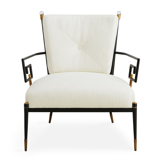 Upholstered armchair with black frame and gold accents.