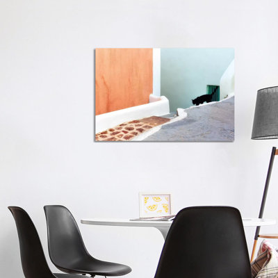 Greece, Santorini. Black Cat Descending Stairway. by Jaynes Gallery - Wrapped Canvas Print