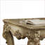 Patine dorée Table basse Bone avec pieds à volutes - Surface compacte polyvalente pour le salon
