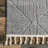 Ebern Designs Kerry Textured Geometric Tasseled Area Rug-1590788282