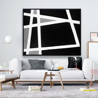 Reproduction de formes abstraites noires et blanches sur toile