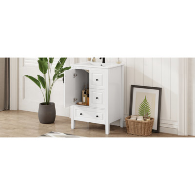 Meuble-lavabo blanc de 61 cm (24 pouces) avec lavabo en céramique intégré, armoire et tiroirs à fermeture amortie, poignées rétro en métal noir, éléments en alliage d'aluminium pour un rangement optimal.