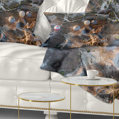 Coussin lombaire imprimé vol avec ballons au lever du soleil