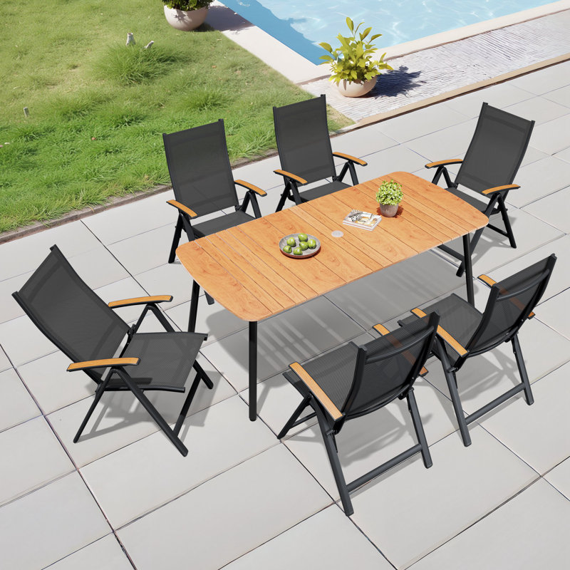 6 - Person 70.9'' L X 33.1'' W Rectangular Patio Dining Set with Umbrella Hole, Aluminum Frame and Folded Reclining Armchairs