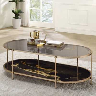 Table basse, verre, peinture marbrée noire et finition dorée