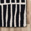 Tapis noir / ivoire / crème en laine fabriqué à la main à motif géométrique Odalis-401972265