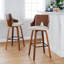 Tabouret de bar à hauteur fixe avec pivot en bois noir et tissu avec repose-pieds rond en métal noir - ensemble de 2