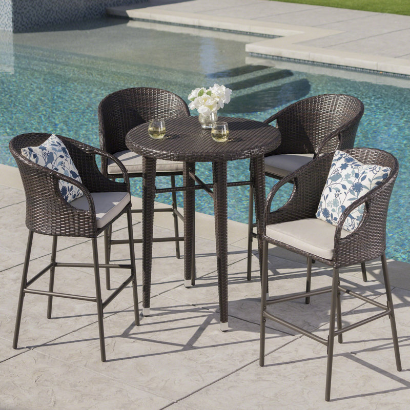Bargnare 4 - Person Wicker Patio Dining Set with Round Table , Cushions Included
