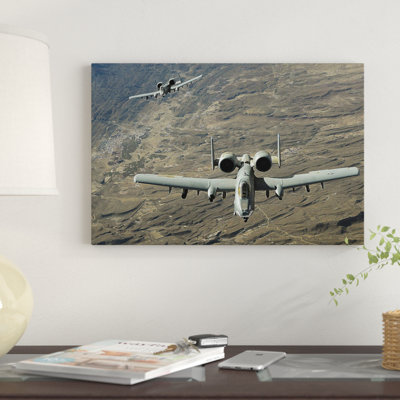 " A Two-Ship A-10 Thunderbolt II Formation Flies A Combat Mission Over Afghanistan " by Stocktrek Images