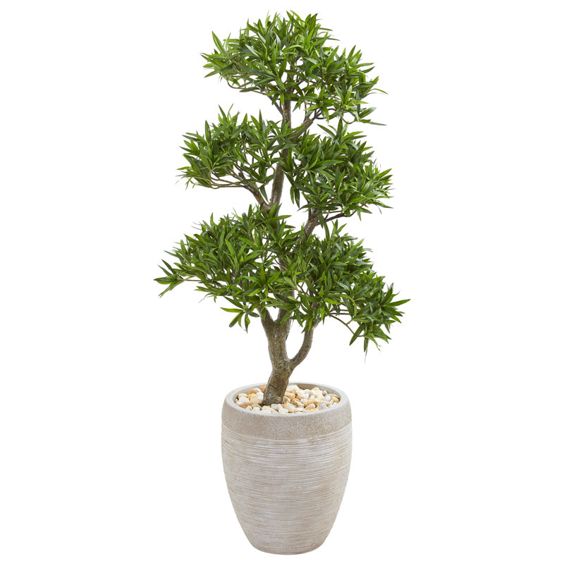 Bonsai artificiel stylisé dans un pot à fleurs Podocarpus