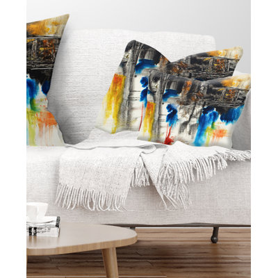 Coussin décoratif à motif abstrait noir, bleu et jaune
