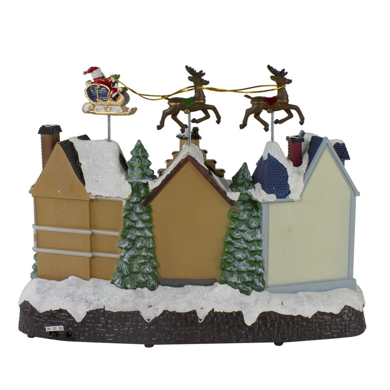 16" White and Brown LED Lighted and Animated Christmas Village with Flying Sleigh Tabletop Decor