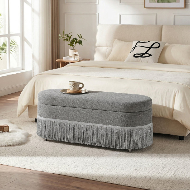 Repose-pieds de rangement ovale à plateau relevable avec bordure à franges, Gris