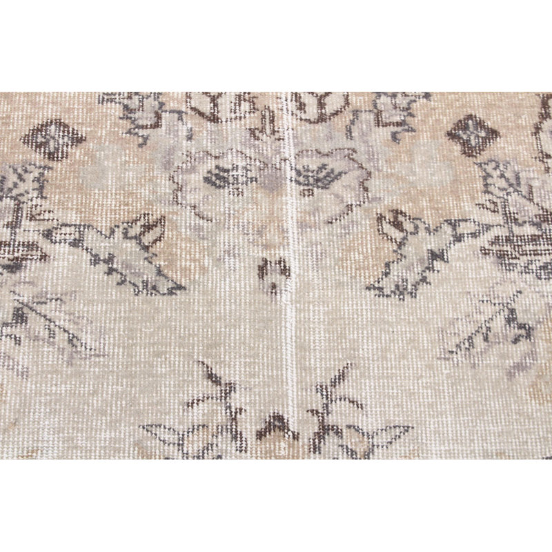 Vintage Handwoven Turkish Rug with Unique Beige Floral Design Made from Wool
