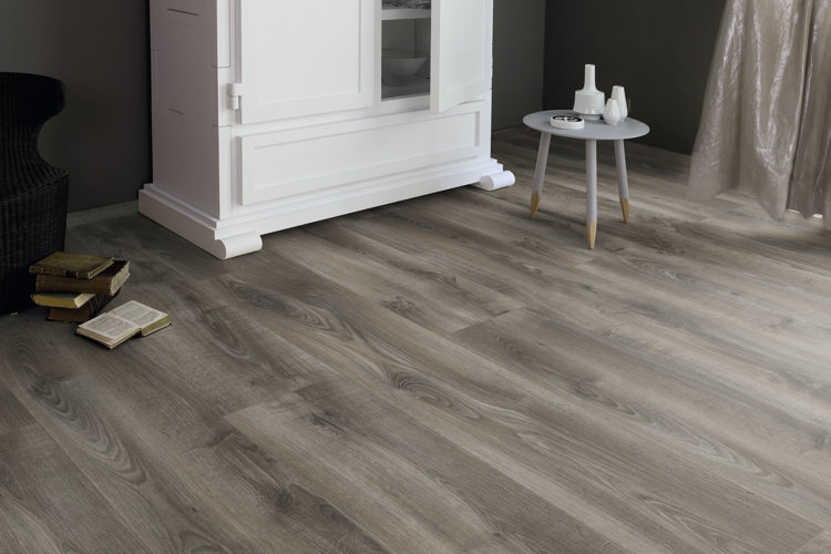 laminate flooring in room with minimal furniture
