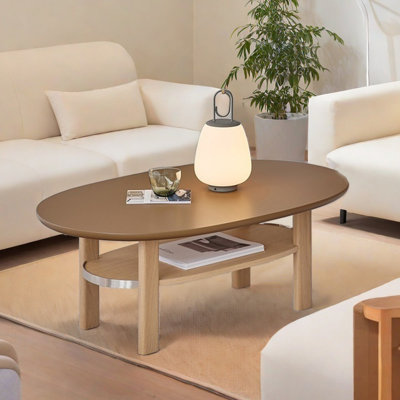 Table basse ovale avec détails en métal
