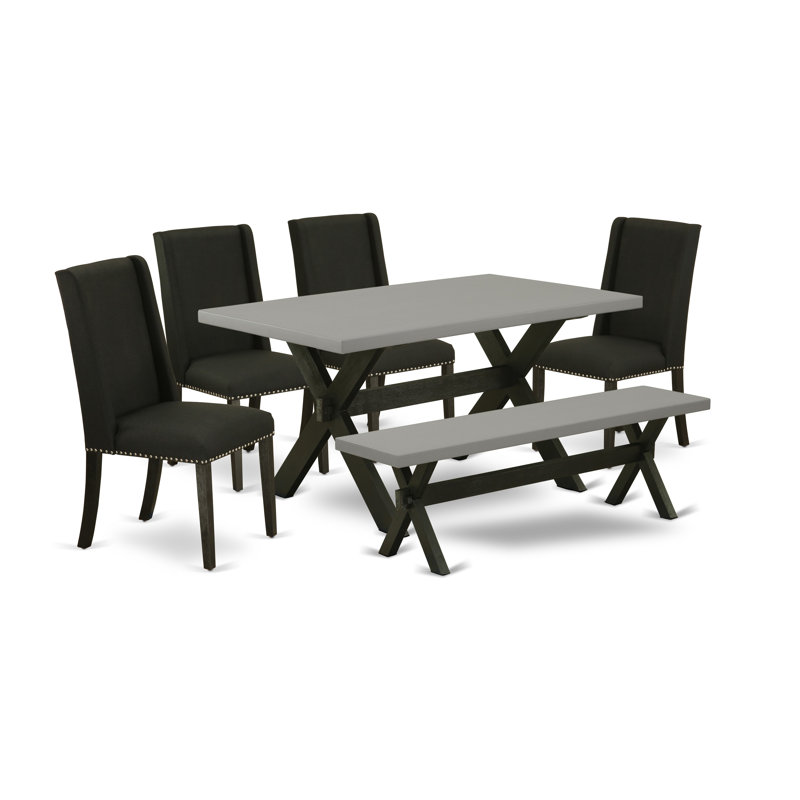 L'ensemble de table de cuisine 6 pièces comprend une table de salle à manger rectangulaire avec pieds en X et 4 chaises Parson en tissu noir avec banc, noir brossé