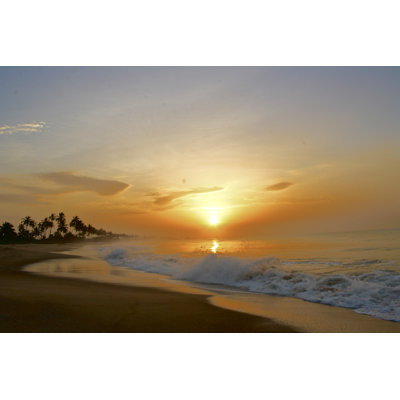Sunrise On The Beach In Ghana by KPlewes - Wrapped Canvas Print