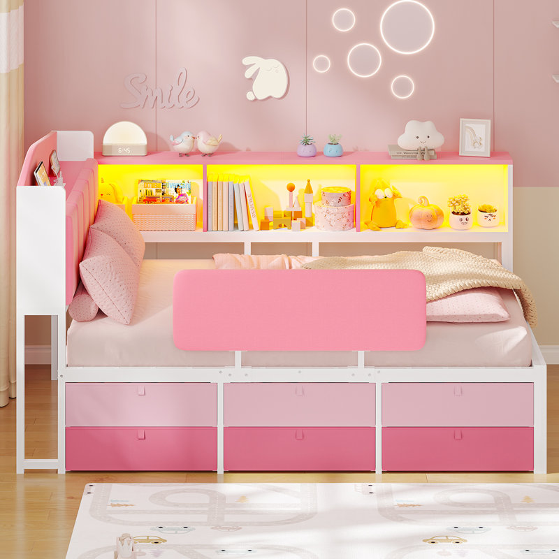 Lit de jour d'angle une place pour enfant, lit plateforme rembourré avec 6 tiroirs de rangement, 3 niches ouvertes, barrière de sécurité, lumières DEL RVB et station de recharge, rose