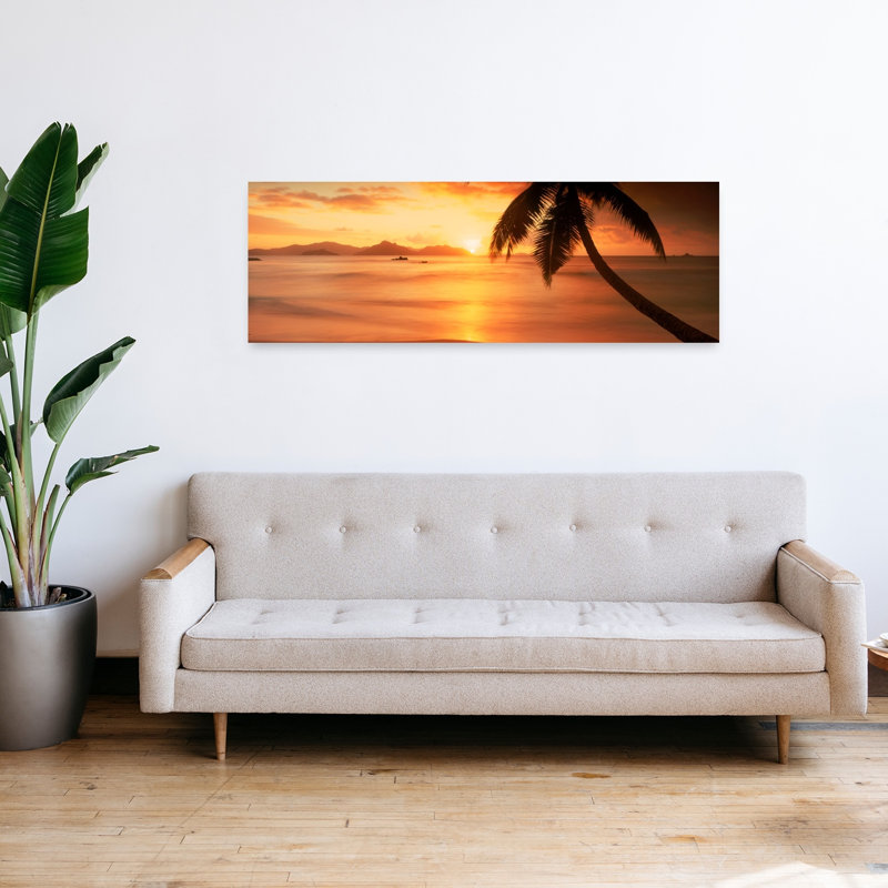 Silhouette Of A Palm Tree On The Beach At Sunset Anse Severe La Digue Island Seychelles by Chad Ehlers - Wrapped Canvas Panoramic Print