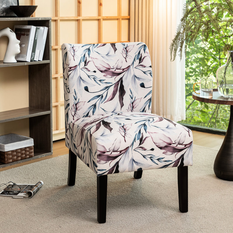 Fauteuil en tissu imprimé avec motif floral mauve - Espace de vie moderne, assise confortable et sans accoudoirs