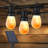 Ambience Pro 27 ft. Solar Outdoor Patio LED String Lights with 12 Warm White Flame-Effect S14 Bulbs, Weatherproof