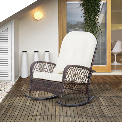 Chaise berçante d'extérieur en osier à assise large, coussin épais et moelleux