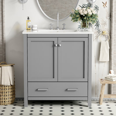 Meuble-lavabo gris de 76 cm (30 po), en bois massif, avec lavabo simple et tiroir. Intérieur spacieux. 2 portes et 1 espace de rangement. Objet de design.