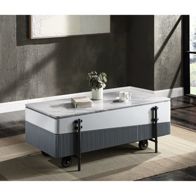 Table basse grise et blanche avec plateau relevable et bac pratique