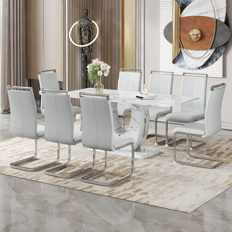 Ensemble de table et de chaises. Ensemble de salle à manger moderne à motif de marbre simple - table de 71 po x 35,4 po avec 8 chaises en polyuréthane. Autocollant à motif de marbre, plateau de table en verre trempé, avec pieds de chaise arqués en métal.
