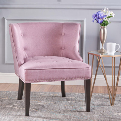 Fauteuil à oreilles capitonné Staas