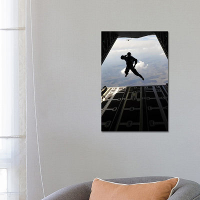 A Paratrooper Salutes As He Jumps Out Of A C-130J Super Hercules by Stocktrek Images - Wrapped Canvas Gallery-Wrapped Canvas Giclée