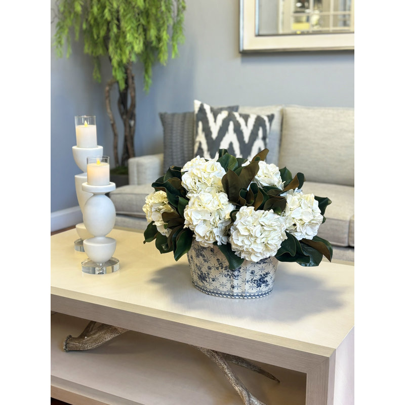 Hydrangeas and Magnolia Leaves Arranged in Decorative Vase
