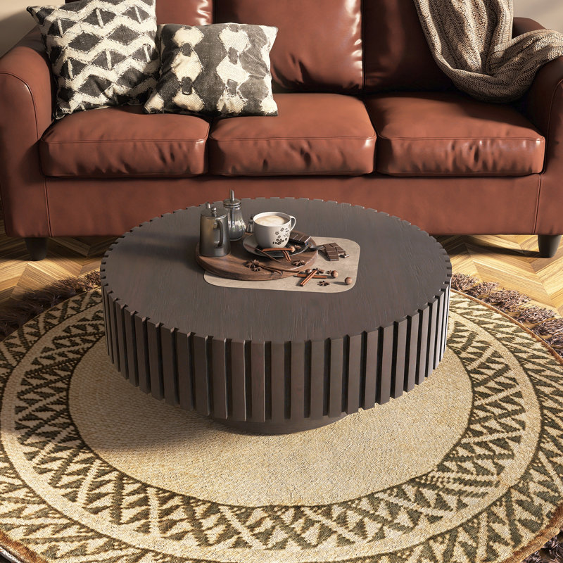 Table basse ronde fabriquée à la main avec relief et pédale, Noir