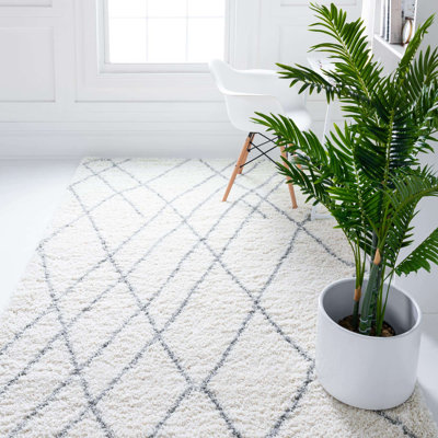 Tapis ivoire à motif géométrique