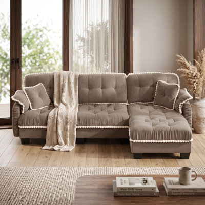 Canapé modulaire 3 places en chenille marron avec pouf, coussins profonds et finitions à pompons