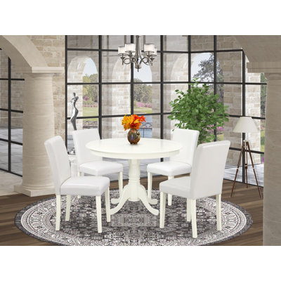 L'ensemble de salle à manger 5 pièces comprend une table de salle à manger ronde avec piédestal et 4 chaises Parson revêtues de similicuir blanc, 42 x 42 po, lin blanc