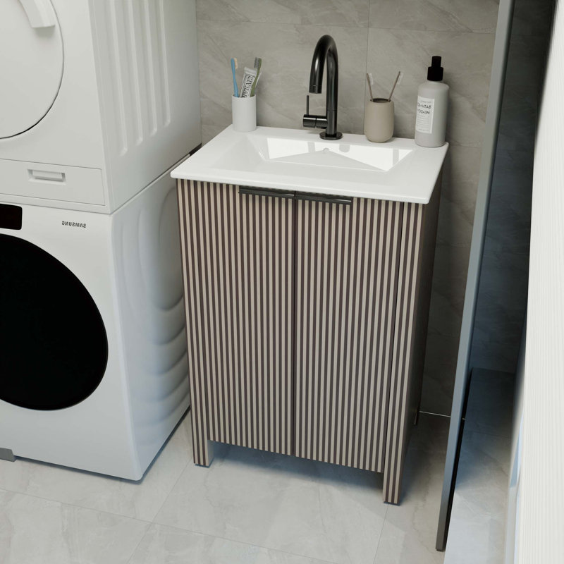 L'armoire de salle de bain sur pied de 30 pouces, jumelée à un lavabo en céramique, est pliable et facile à transporter