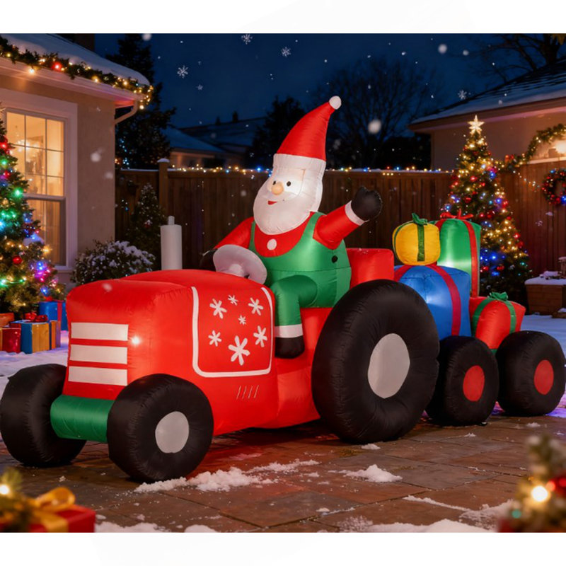 Père Noël gonflable sur remorque avec charge de cadeaux