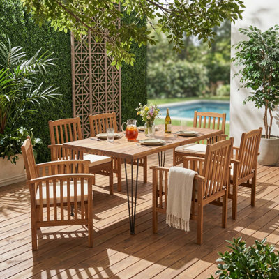 7-Piece Dining Set with Acacia Wood Table and Six Slat-Back Chairs for Indoor and Outdoor Use, Featuring Weather-Resistant Construction and Easy-Clean Design.