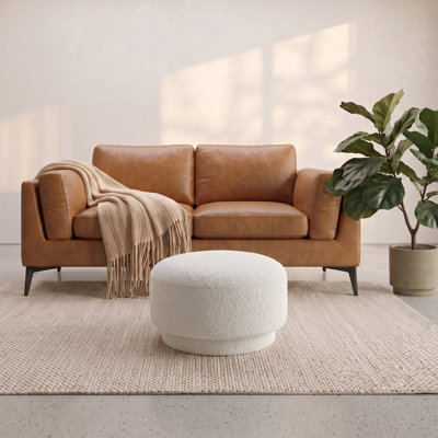 Repose-pieds rond rembourré