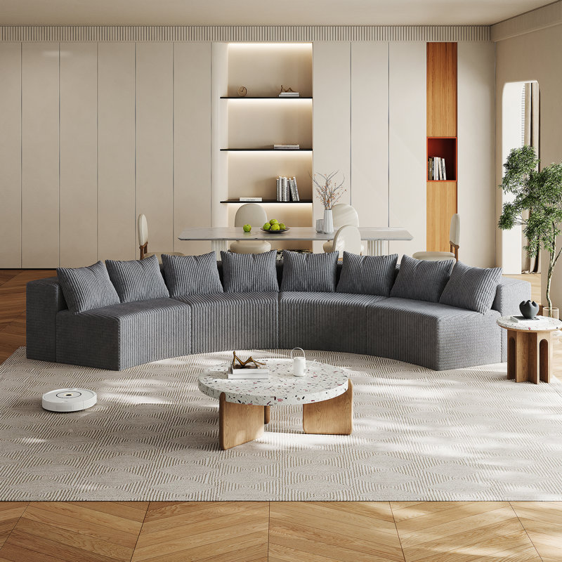 Canapé modulaire incurvé confortable avec plusieurs coussins, idéal pour diverses pièces, Gris